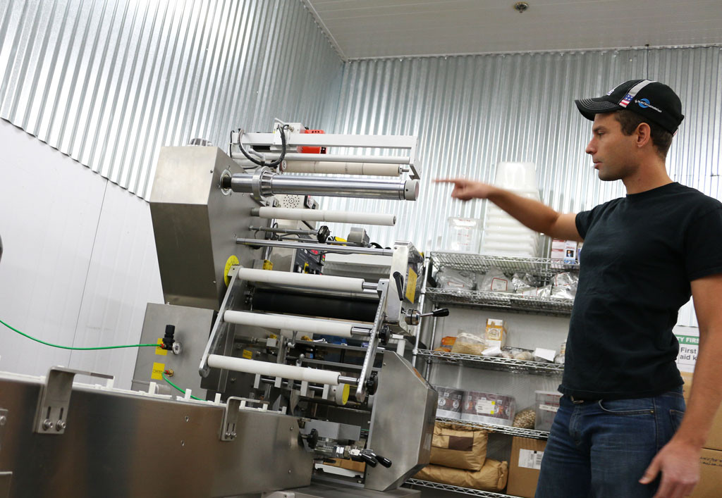 Brian Cornelius describes the complex functionality of RBar's most recent purchase: a wrapping machine.