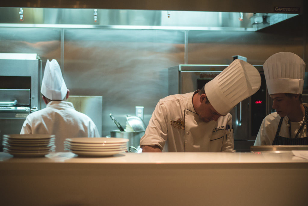 Chef Ryan Clark plating at PY Steakhouse at the Casino Del Sol Resort (Credit: Jackie Tran)