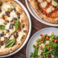 Pizza Bianca, Pizza Margherita, and Insalata Arugula from Fiamme Pizza Napoletana (Credit: Jackie Tran)