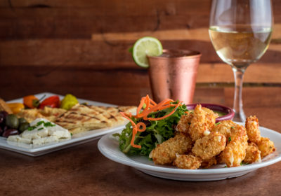 Jalapeno Cheese Curds, Mediterranean Plate, and white wine at Cafe a la C'Art in Tucson. (Photo by Jackie Tran)