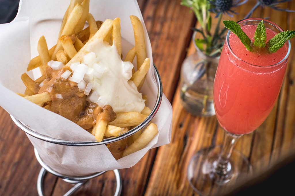 Patat Oorlog (War Fries) and Watermelon Fresca cocktail at the Dutch Eatery & Refuge (Credit: Jackie Tran)