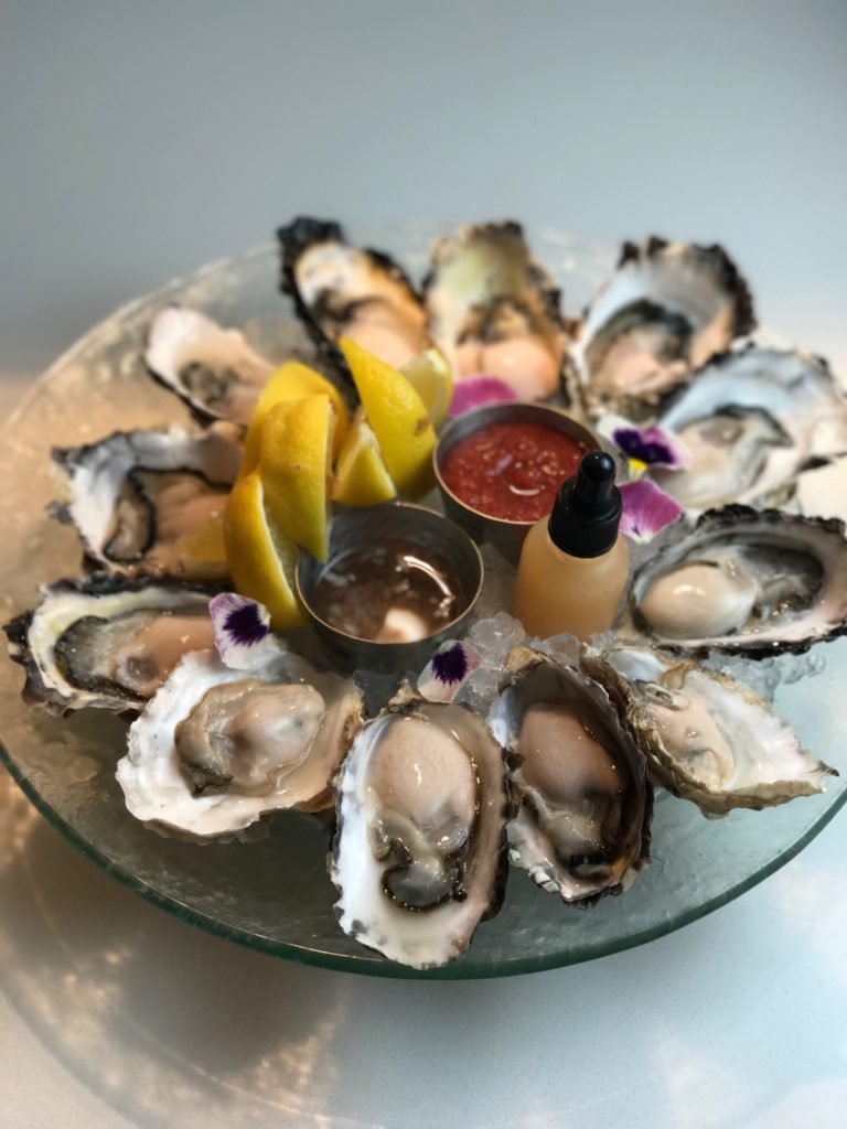 Oysters with shallot mignonette, traditional cocktail sauce, house-fermented habanero hot sauce (Credit: PY Steakhouse)