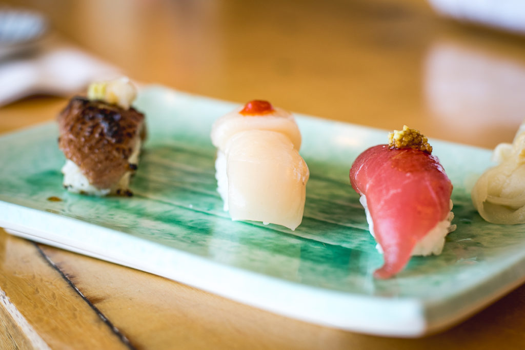 A5 wagyu, Hokkaido giant scallop, and young maguro with grated fresh wasabi and barrel-aged soy sauce at Sushi on Oracle (Credit: Jackie Tran)