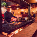Mario Alva at the grill pit at Silver Saddle Steakhouse (Credit: Jackie Tran)