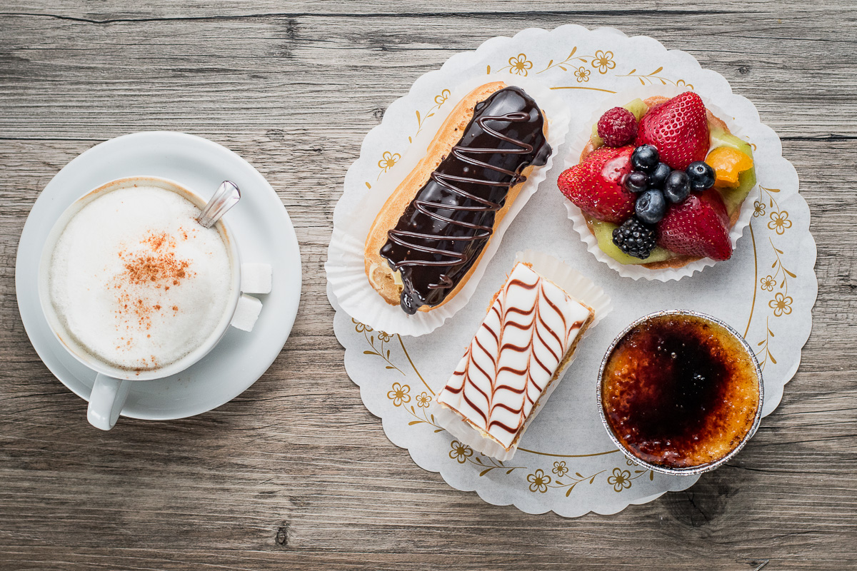 Latte, eclair, fresh fruit tart, Napoleon, and crème brûlée at Ghini's French Caffe and La Baguette Bakery (Credit: Jackie Tran)