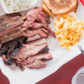 Three-meat plate with ribs, brisket, tri-tip, potato salad, and mac and cheese at Holy Smokin' Butts (Credit: Jackie Tran)