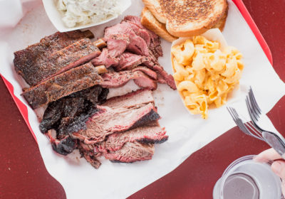 Three-meat plate with ribs, brisket, tri-tip, potato salad, and mac and cheese at Holy Smokin' Butts (Credit: Jackie Tran)
