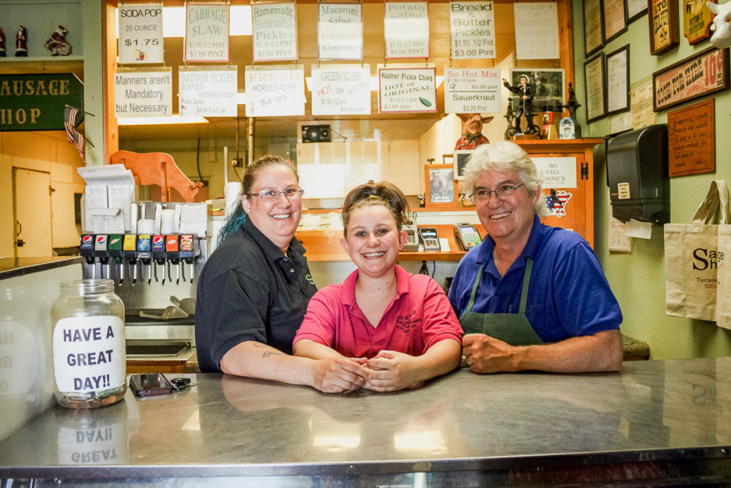 Kent Koecheler (right) with his daughter Barbie (left) and granddaughter Leah (center) at Sausage Shop (Credit: Chelsey Wade)