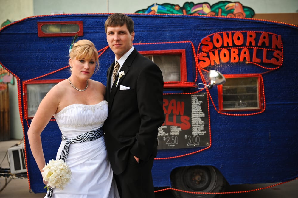 Nicole and Marcus van Winden with the old Sonoran Snoballs truck on their wedding day (Credit: Kelly Rashka)