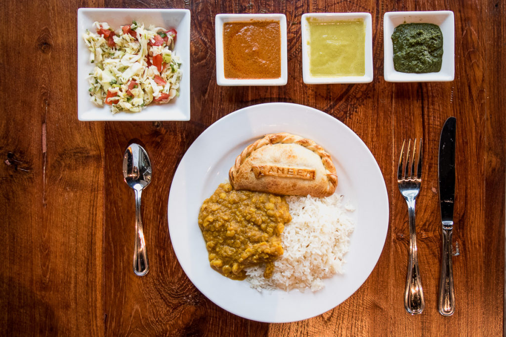 Paneer empanada, dahl, and rice at Bombolé Eatery (Credit: Jackie Tran)