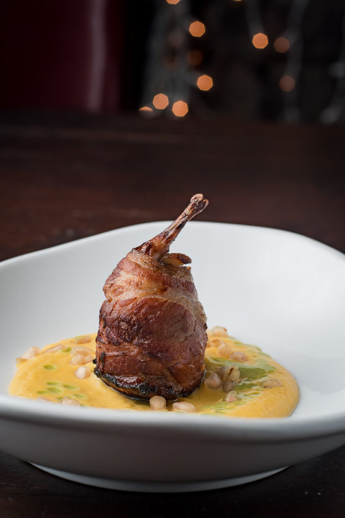 Bacon-Wrapped Quail at DOWNTOWN Kitchen + Cocktails (Credit: Jackie Tran)