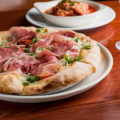 Prosciutto di Parma Rotondo, Arugula, and Fresh Tomatoes Pizza at Scordato's Pizzeria (Credit: Jackie Tran)