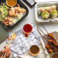 Grilled Shrimps topped with Coconut Curry Sauce on Jasmine Rice, Vietnamese Spring Rolls and Grilled Chicken Skewers with Peanut Sauce from Miss Saigon (Credit: Melissa Stihl)