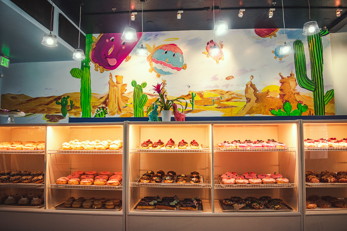 Doughnuts and mural at Holy Donuts (Credit: Jackie Tran)