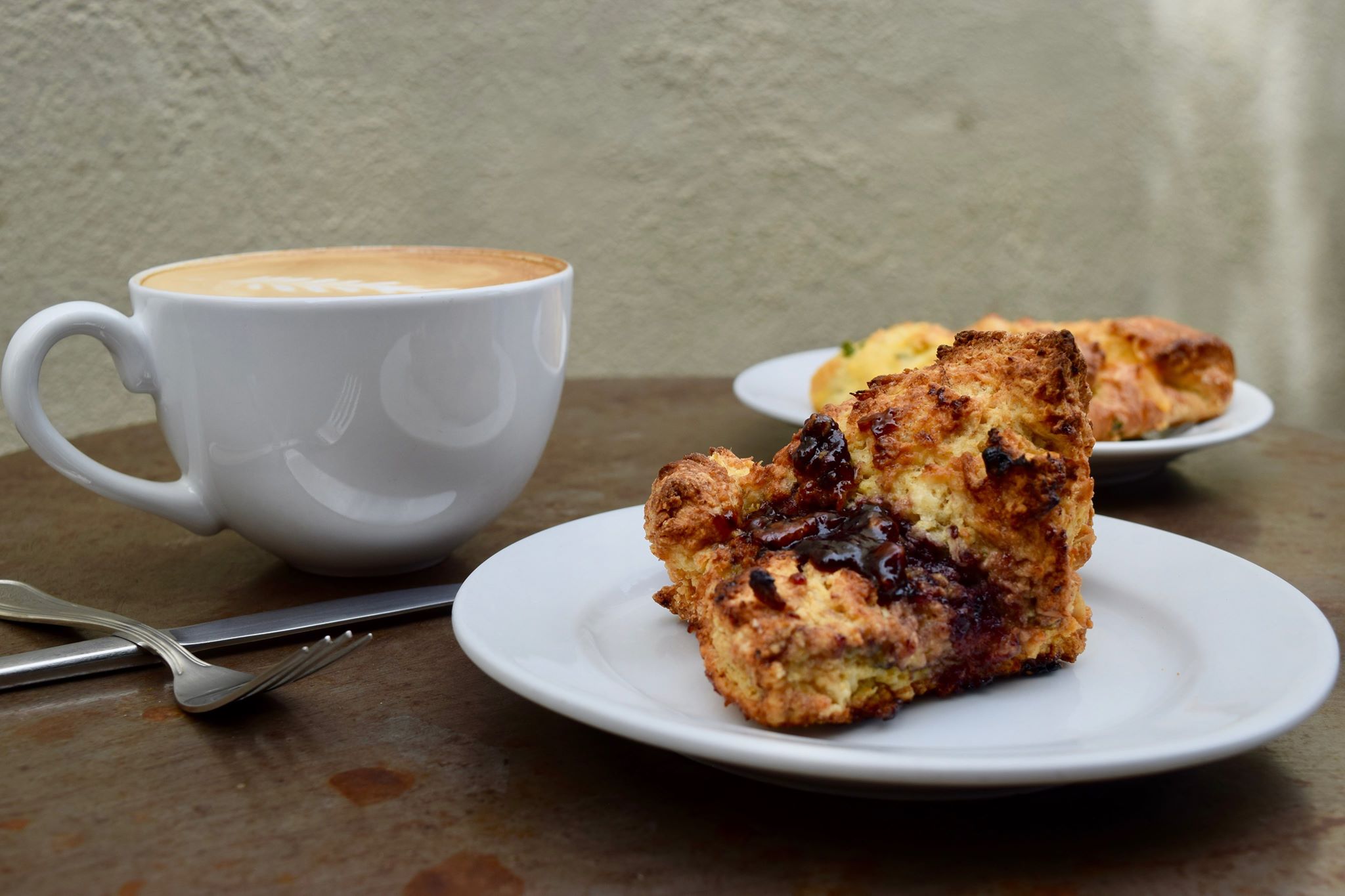 Toasted Almond Scone with Boysenberry Jam and Coffee at Raging Sage (Credit: Dana Sullivan)