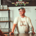 Scott Petersen behind the bar at Green Feet Brewing (Credit: Jackie Tran)