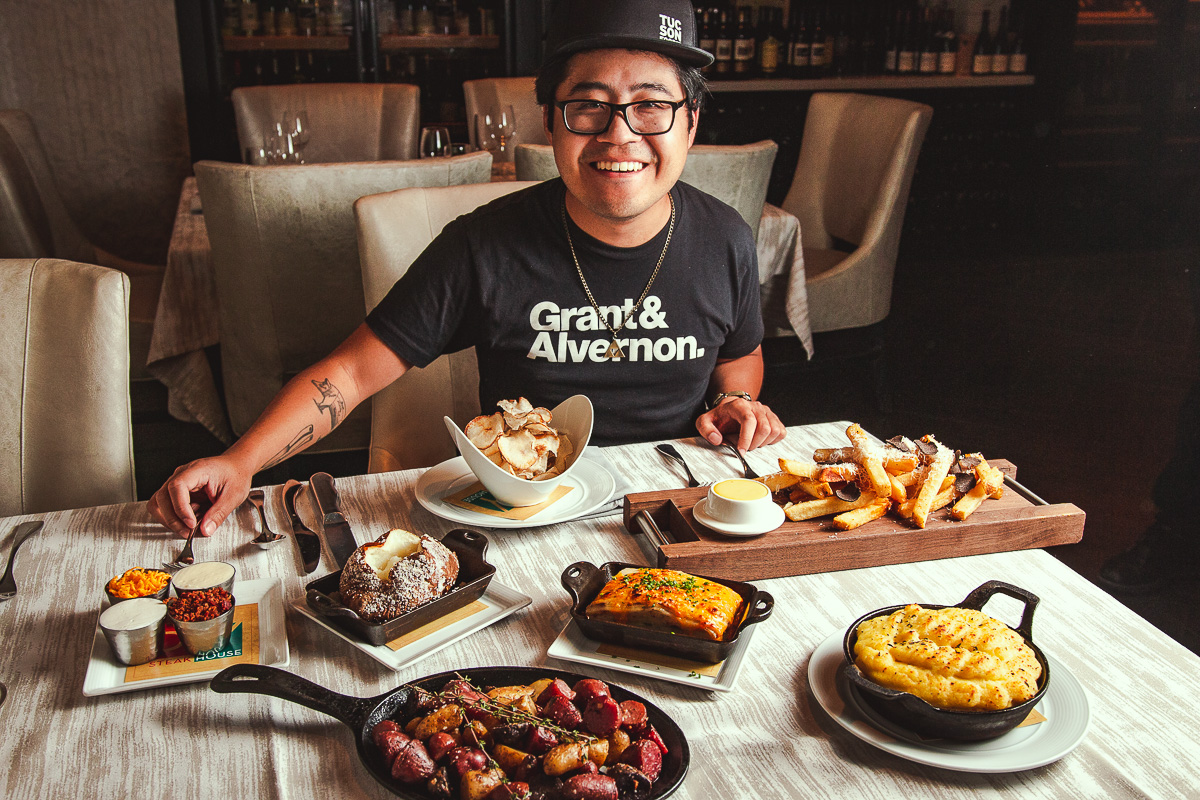 Jackie with $50 of potato dishes at PY Steakhouse (Credit: Melissa Stihl)