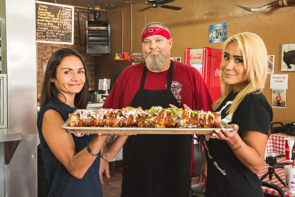 Competitive eaters Michelle Lesco and Miki Sudo with Red Desert BBQ & Catering owner-chef-pitmaster David Martin (Credit: Jackie Tran)