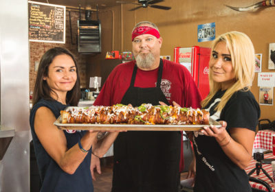 Competitive eaters Michelle Lesco and Miki Sudo with Red Desert BBQ & Catering owner-chef-pitmaster David Martin (Credit: Jackie Tran)