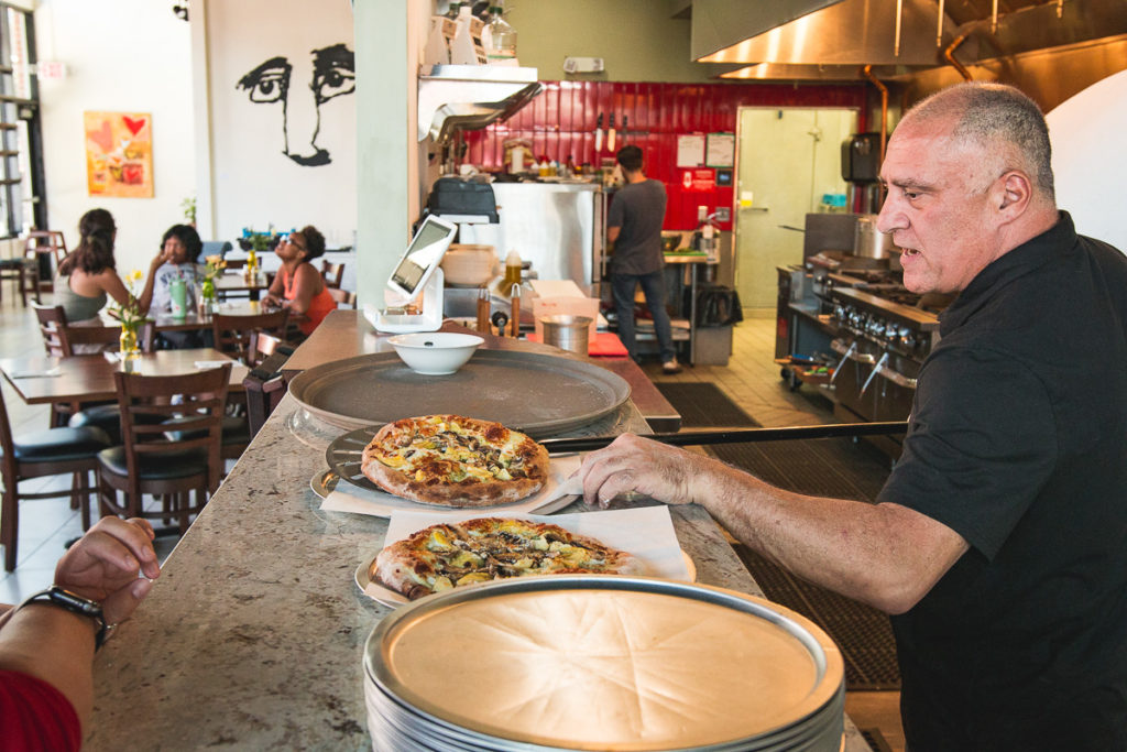 Owner Andrew Avella making pizza at Bacio Italiano