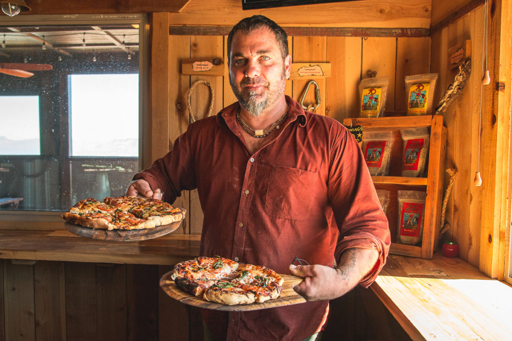 Brandon Luthy and pizzas at Peppersauce Kitchen (