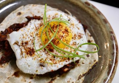 Plate-based vegan Chinese chorizo and a fried egg (Photo by Hannah Hernandez)