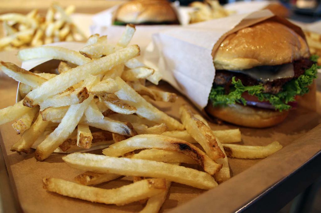 a picture of french fries and burgers