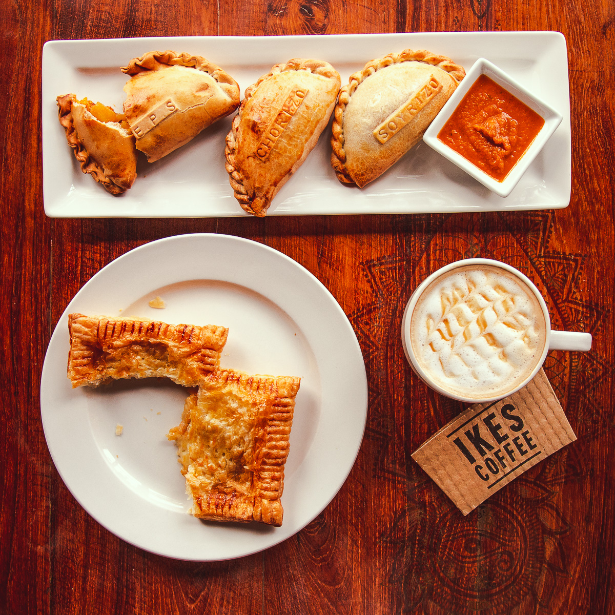 Empanadas, a pasty, and a latte from Ike's Coffee at Bombolé Eatery (Credit: Jackie Tran)
