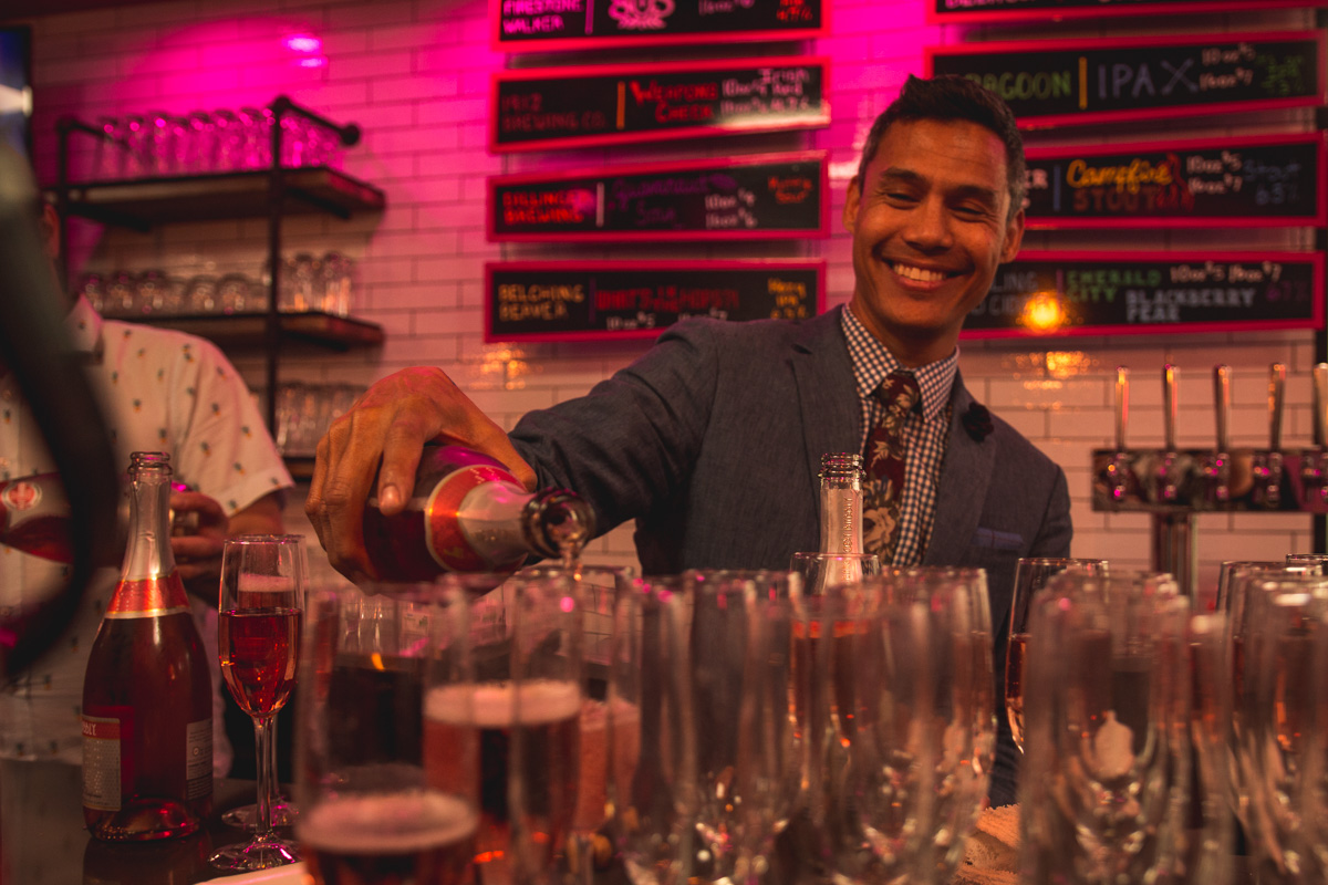James Blue pouring bubbly at Donut Bar Tucson (Credit: Jackie Tran)