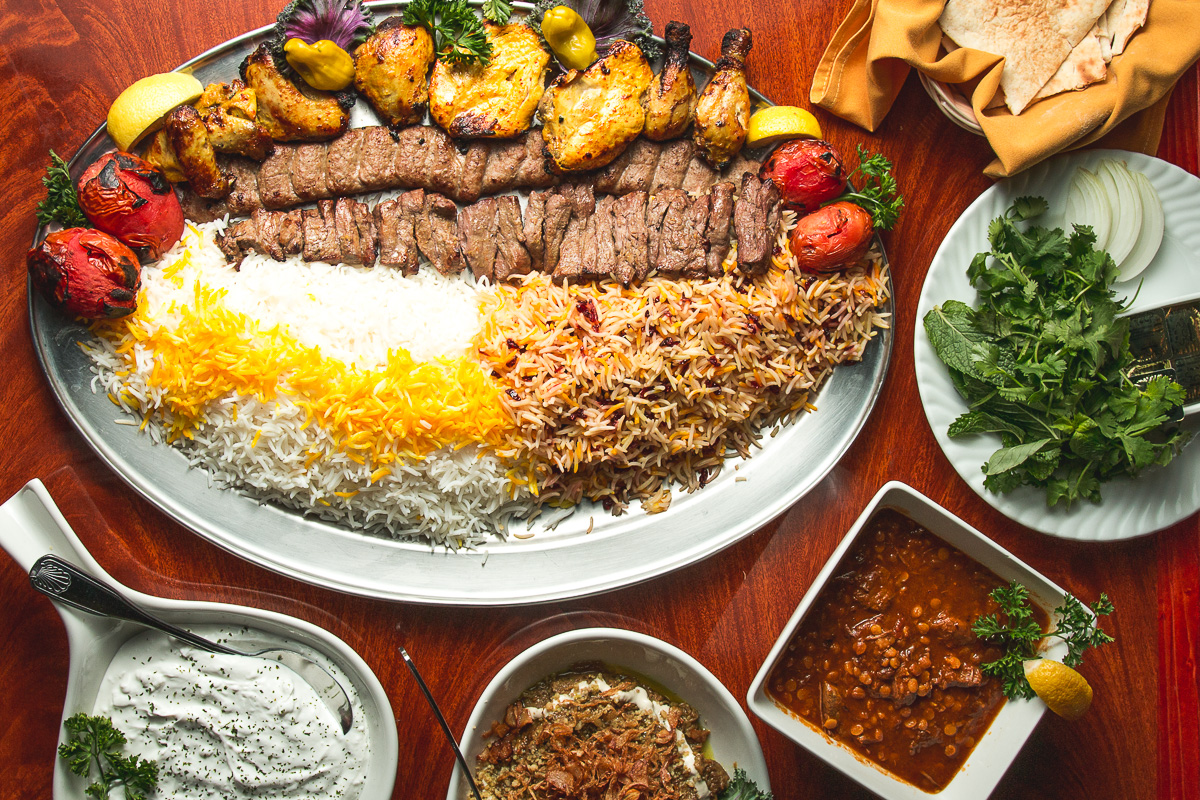 Tour of Persia platter, lavash bread, sabzi, Homemade Yogurt & Garlic Dip (Mast o Moosier), Kash O'Bademjan, and Gheimeh Bademjan at Persian Room