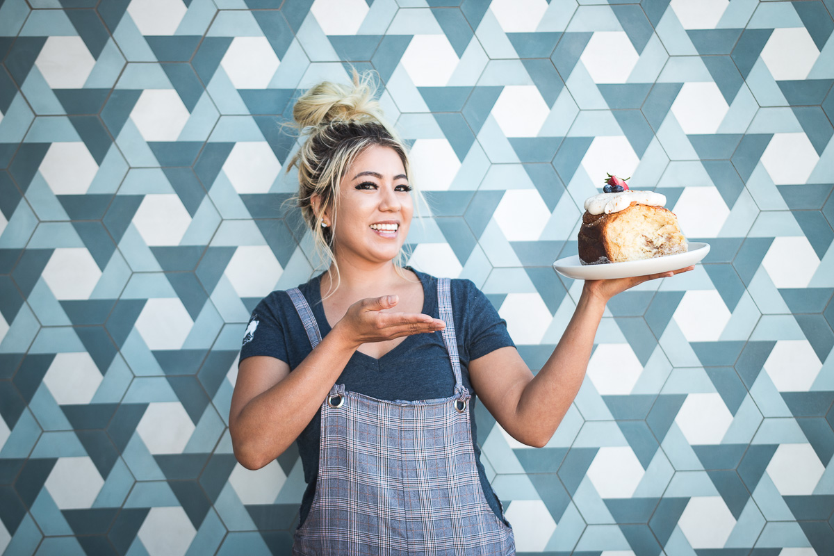Executive pastry chef Kayla Draper with a Classic XL Cinnamon Roll at Prep & Pastry