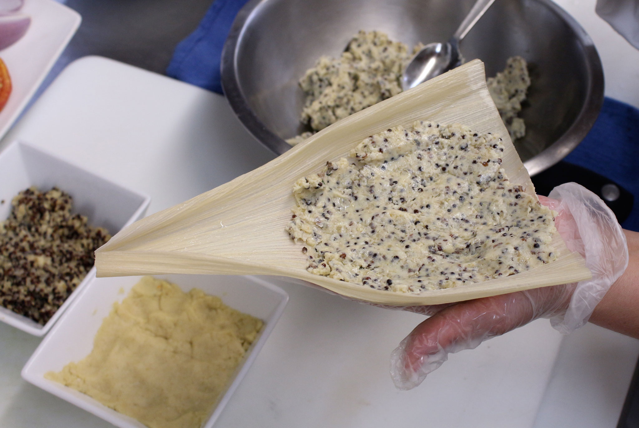 Preparing to fill Quinoa Tamales with Mushroom Duxelle mixture. (Photo credit: Kristin Tovar)