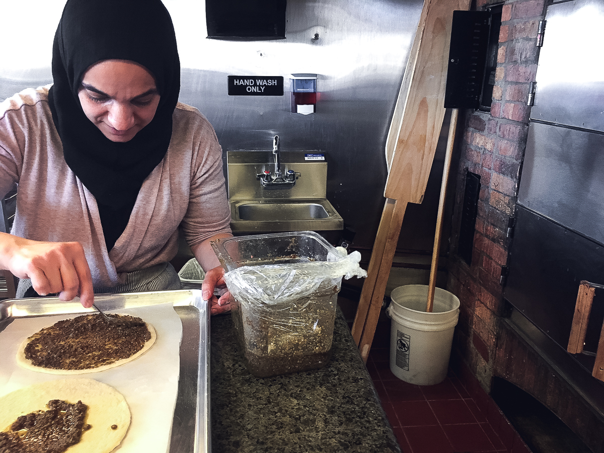 Yasmin preparing Manoushe Zaatar at Caravan Grill (Credit: Meredith O'Neil)