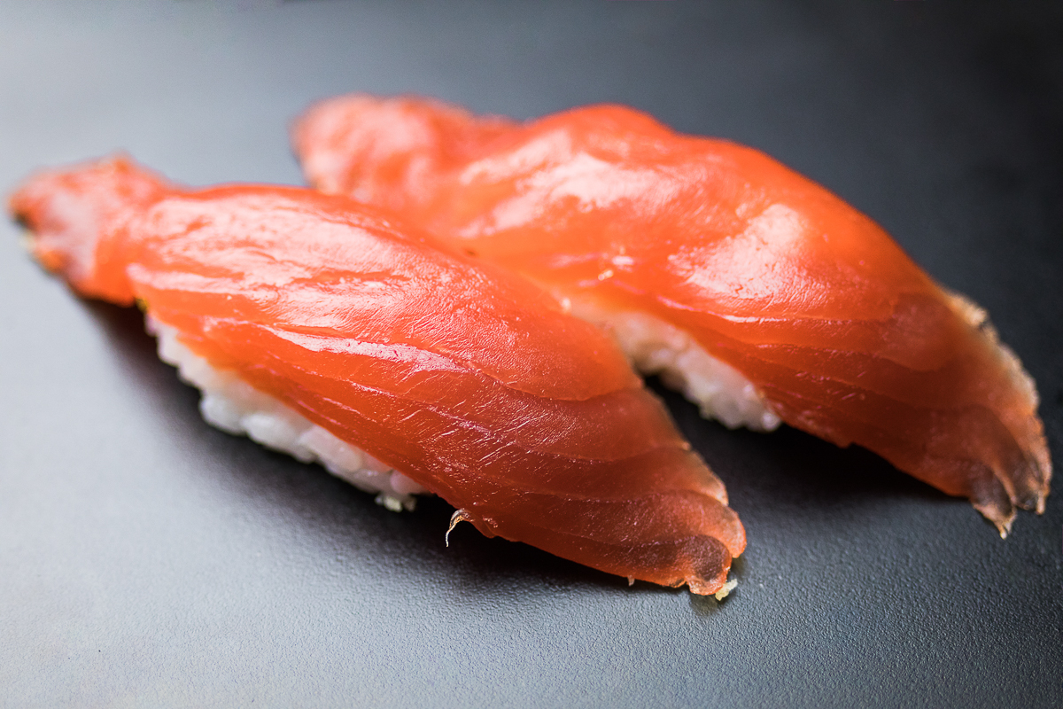 a photo of two pieces of nigiri-style sushi