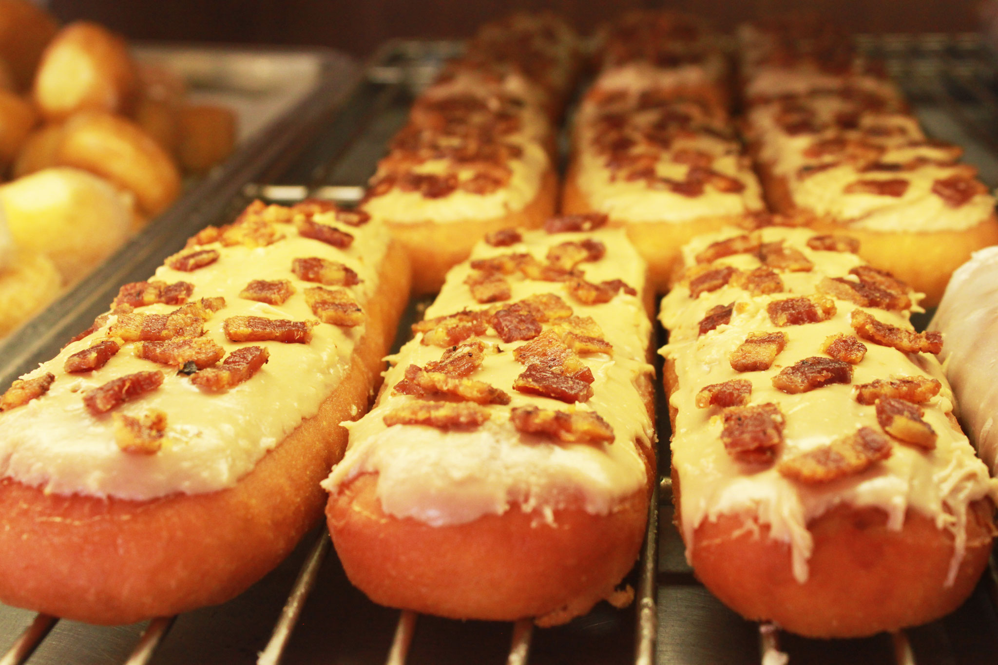 Maple Bacon Glazed Long Johns at Alvernon Donut Shop