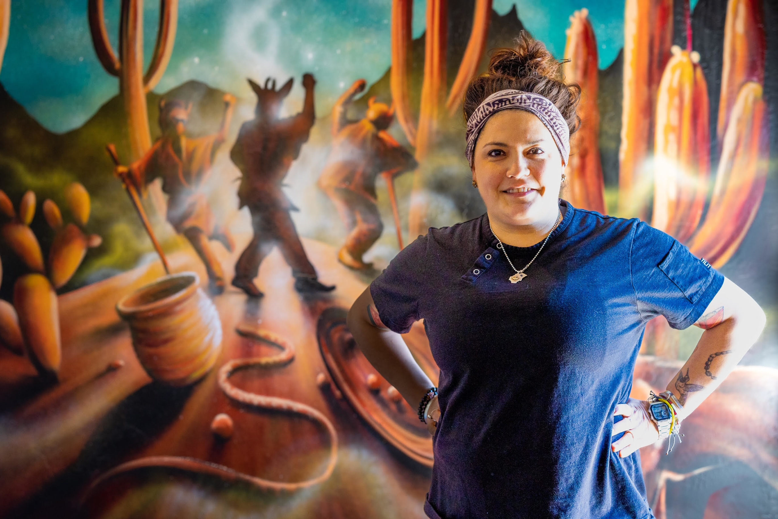 Maria Mazon & a mural by Sangre Del Desierto from Sonora Mexico (Photo courtesy of Borderlands Brewing)