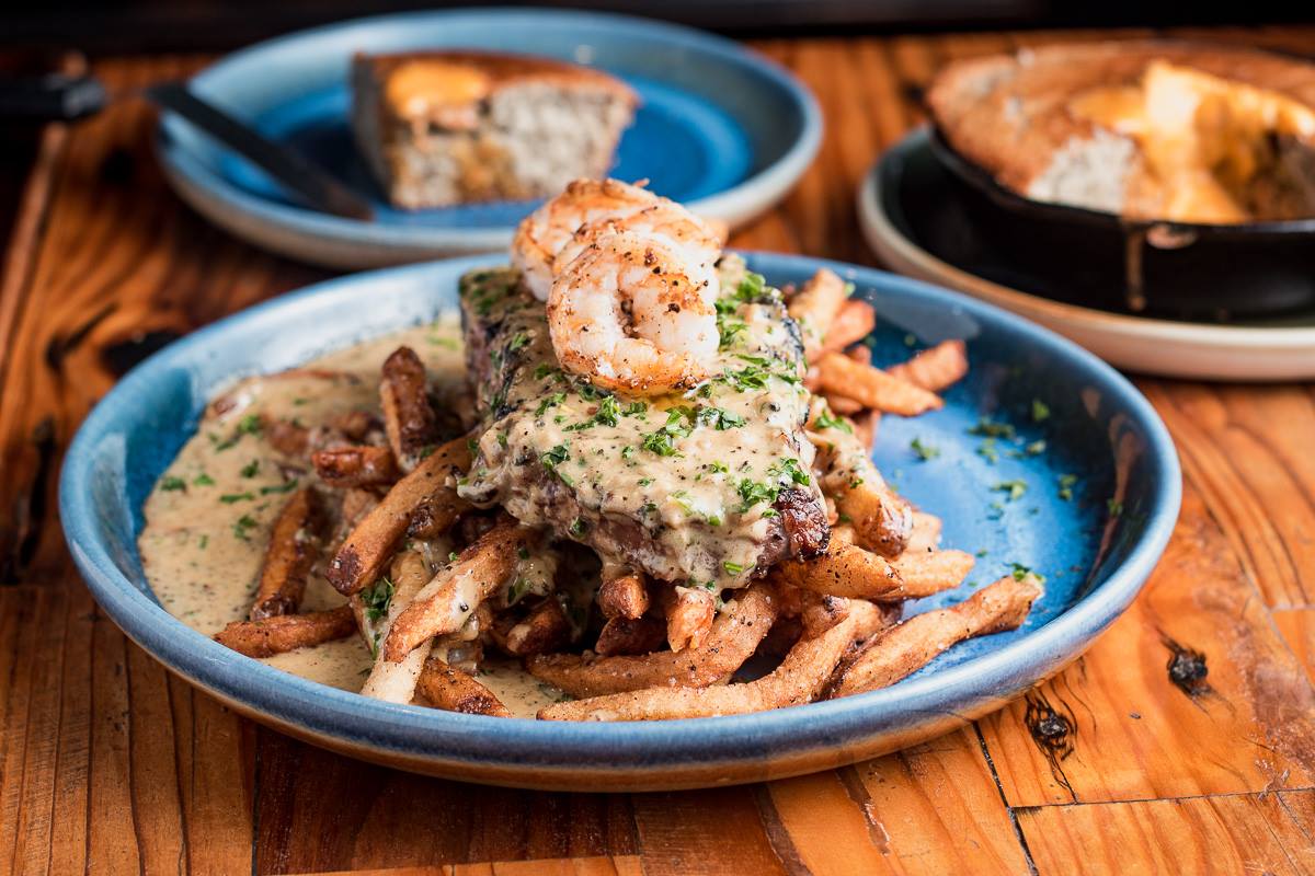 Johnny Steak & Frites plus shrimp at the Parish (Photo by Jackie Tran)