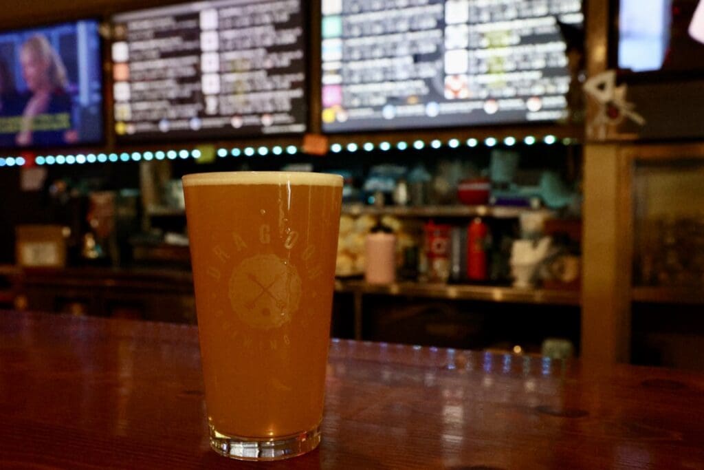 a glass of beer on a table