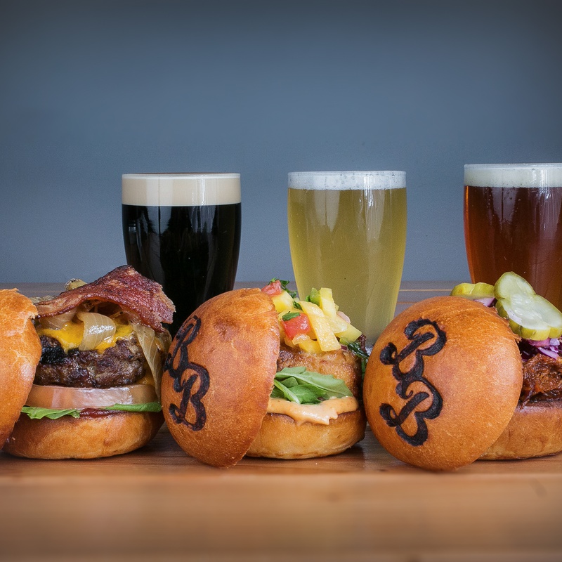 a picture of burgers and beers