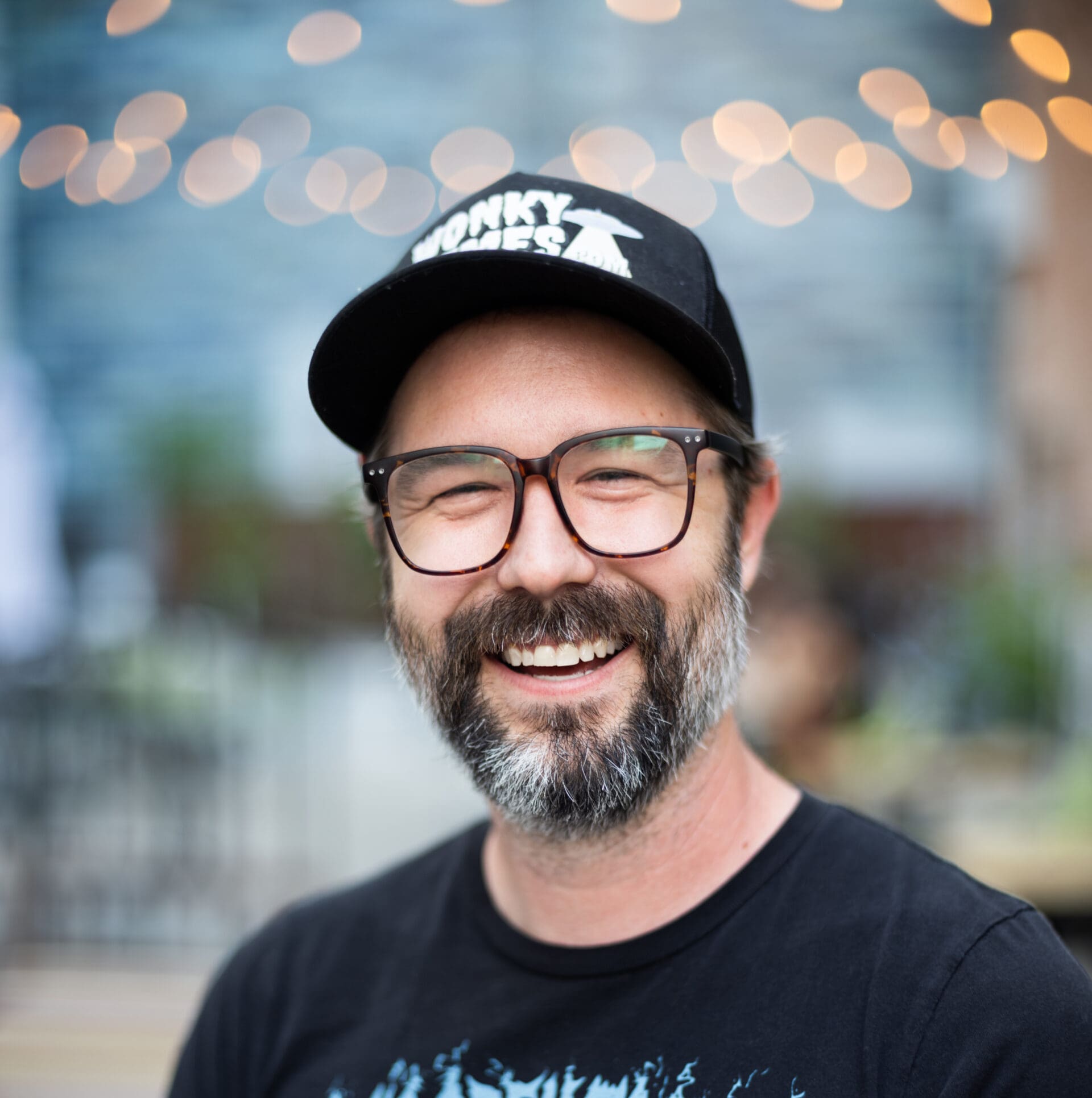 a man wearing a hat and glasses