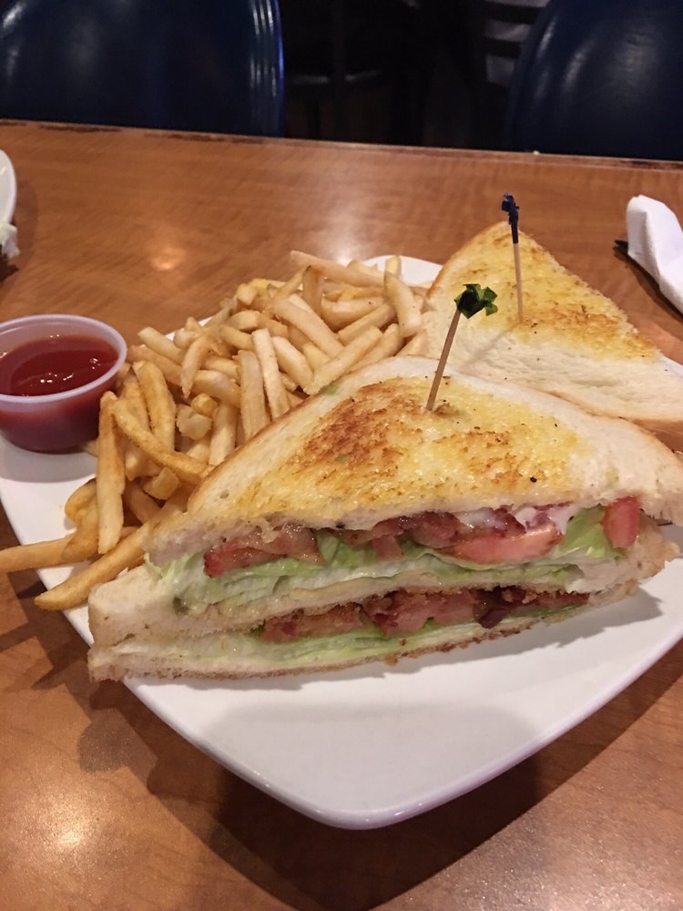 a club sandwich and fries