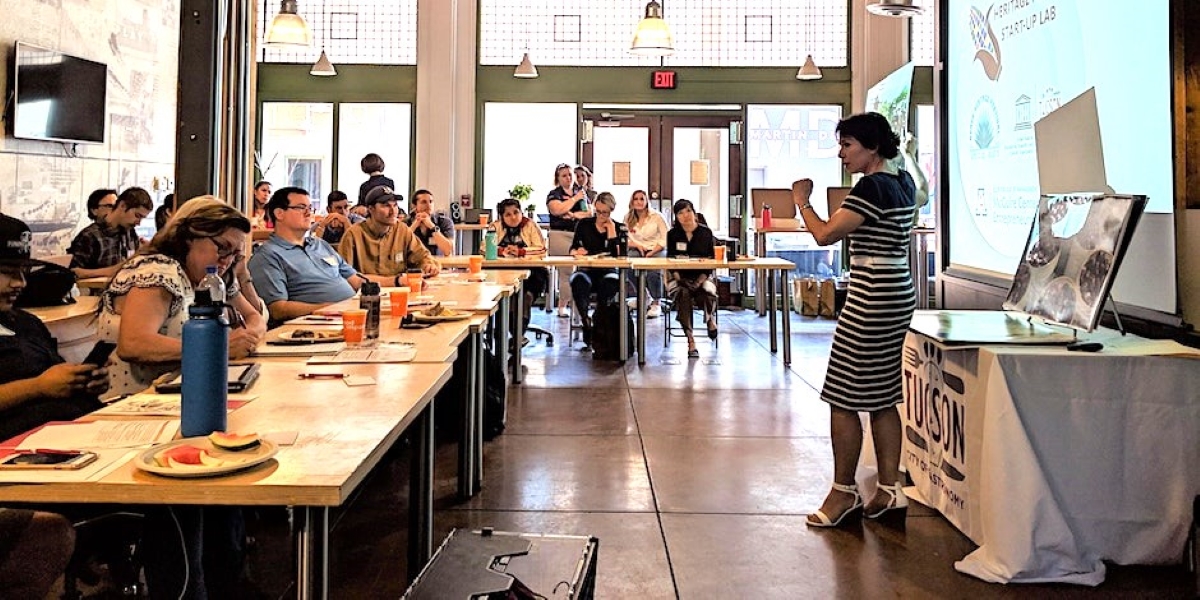 a group of people sitting at a table in a room