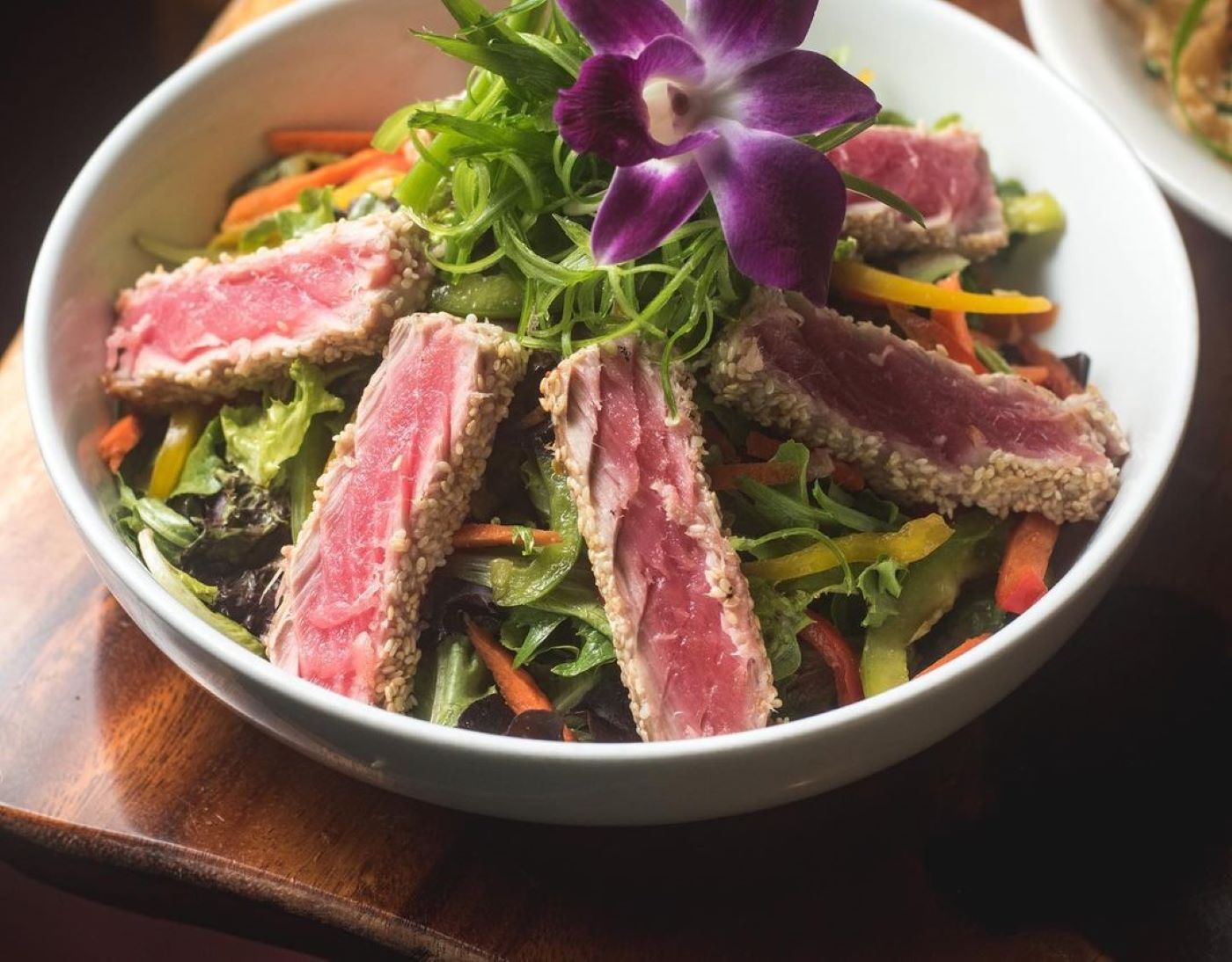 a bowl of salad on a plate