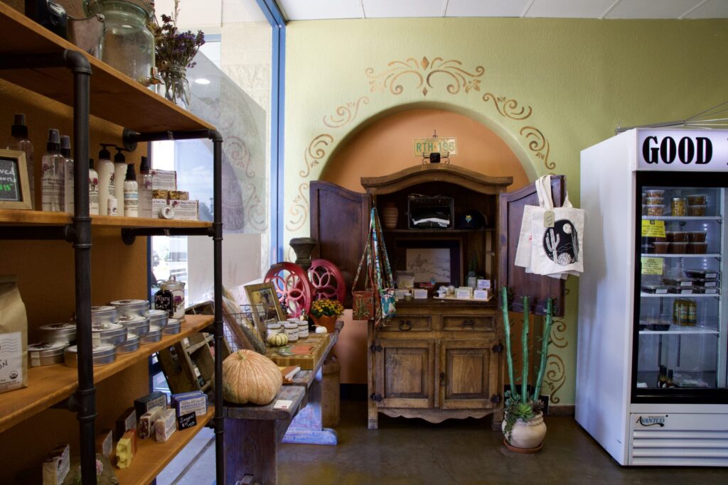 a store in a living room filled with furniture and a fireplace