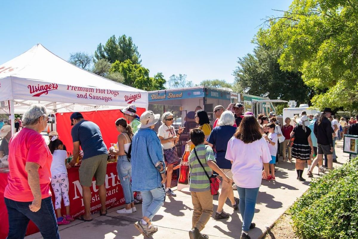 a group of people standing in front of a crowd