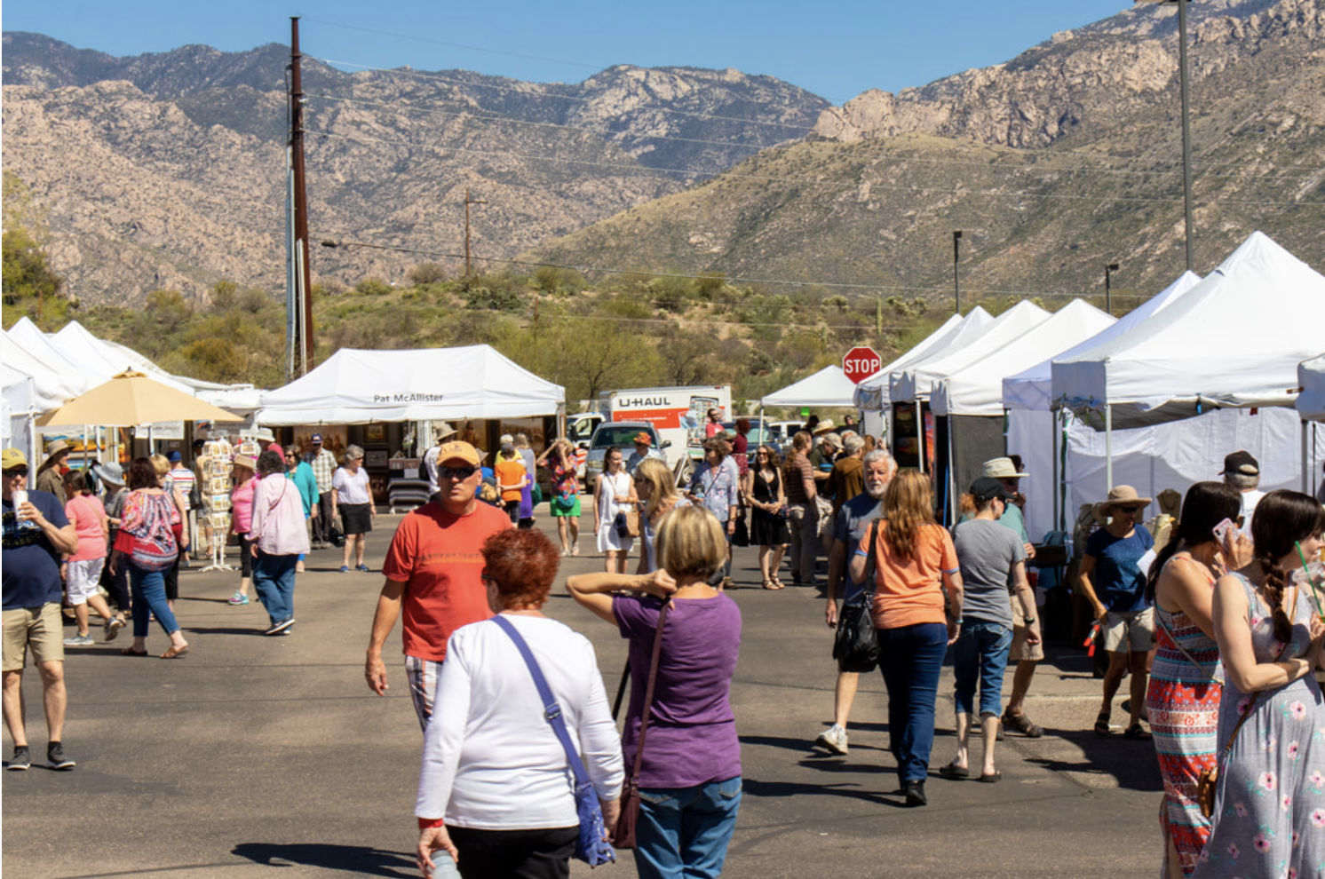 a group of people walking in front of a crowd