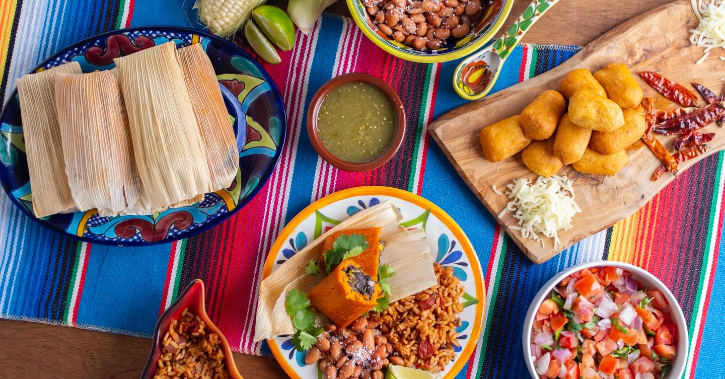 a plastic container filled with different types of food on a table