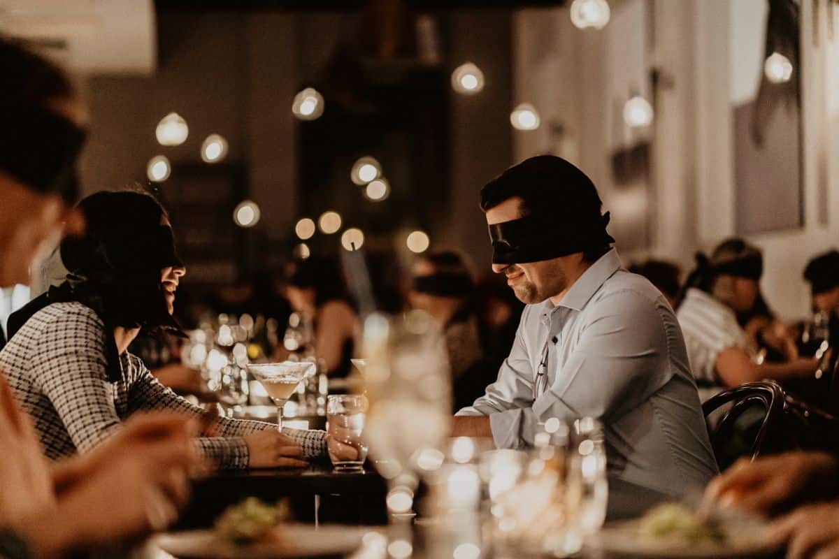 a group of people sitting at a table with wine glasses