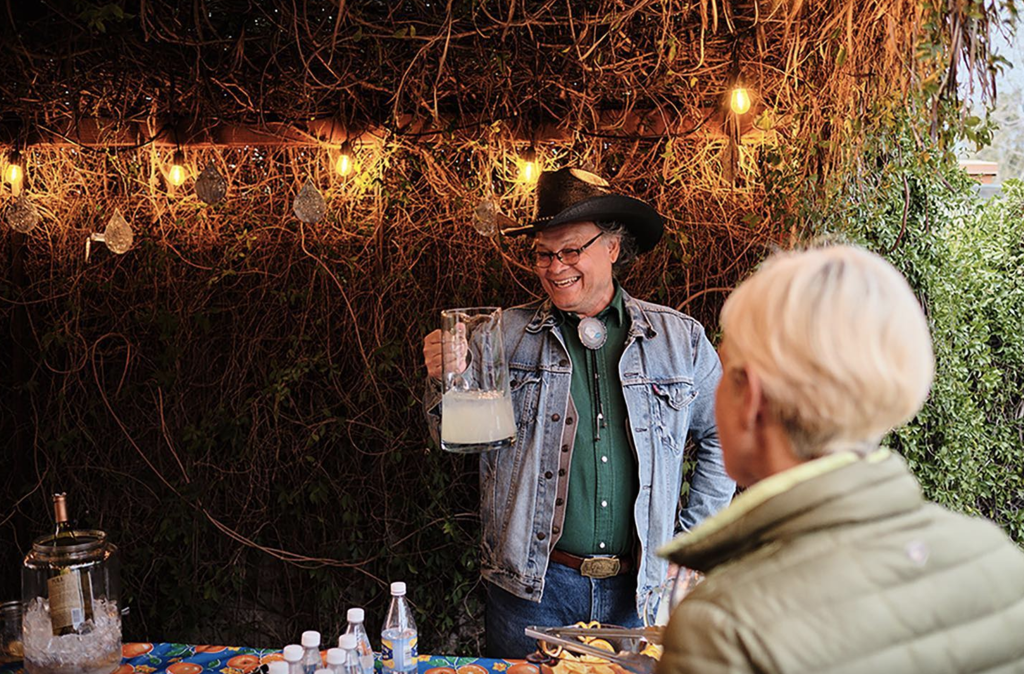 a man standing in front of a cake