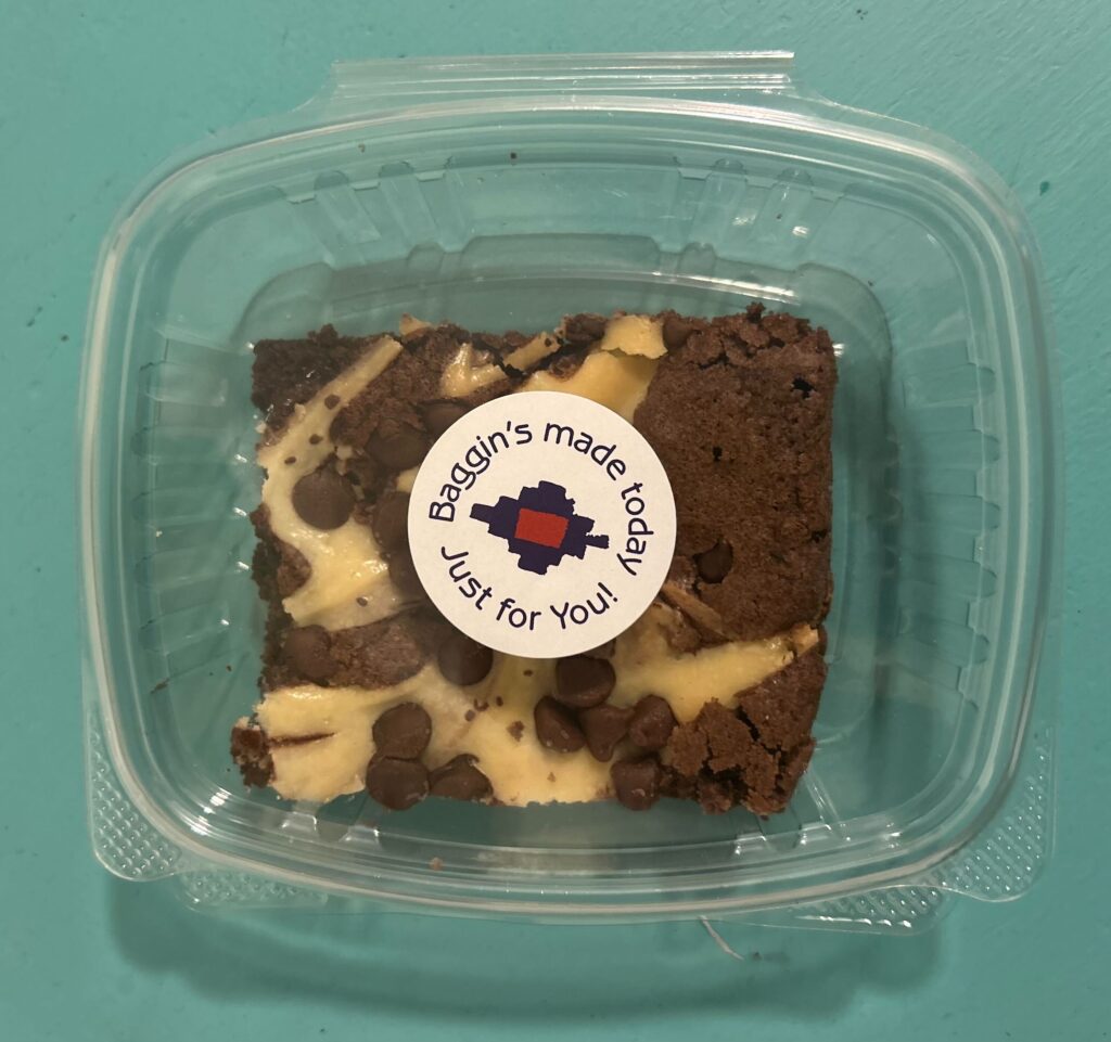 a piece of cake sitting on top of a plastic container